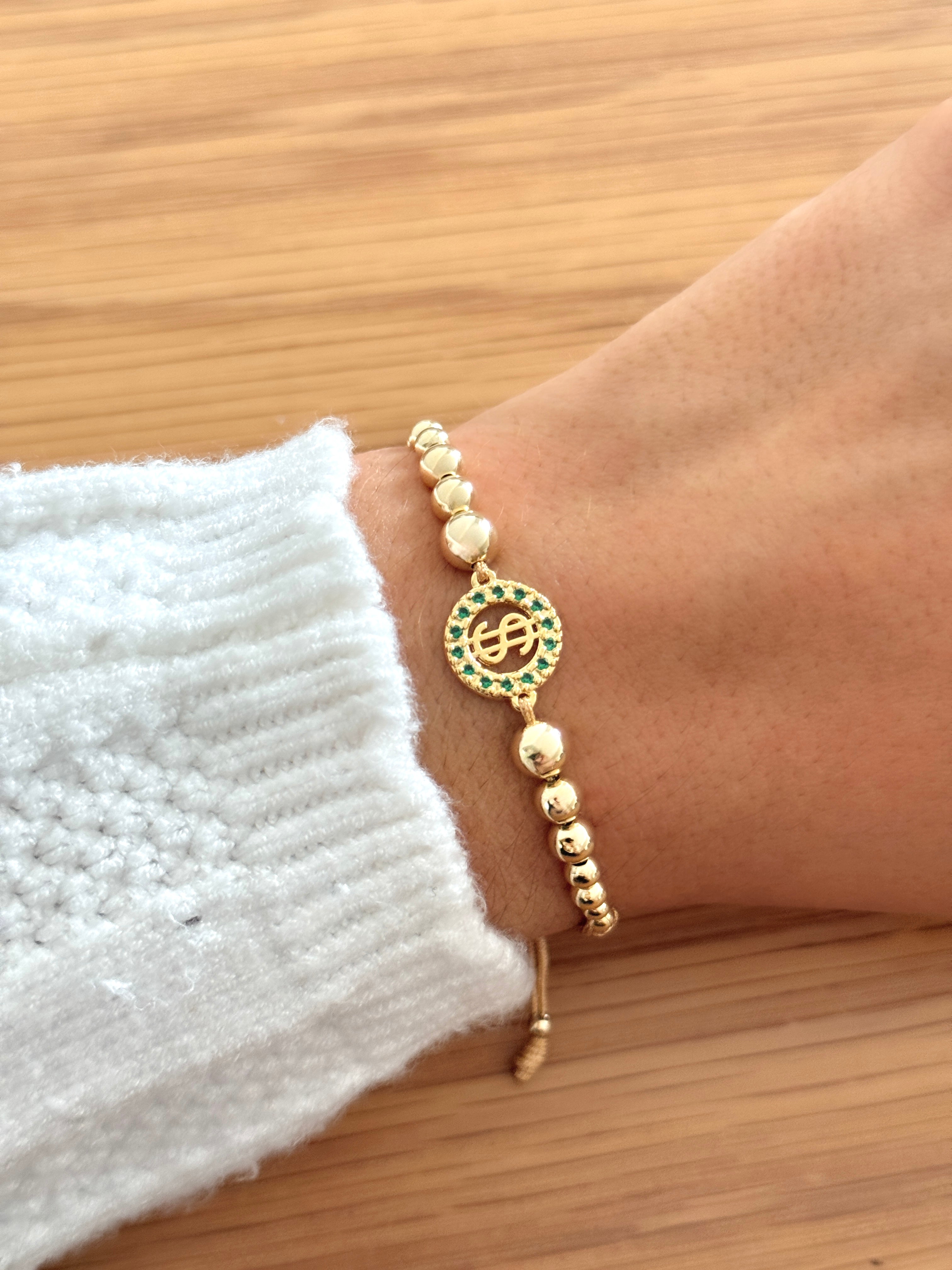 Pulsera artesanal signo pesos