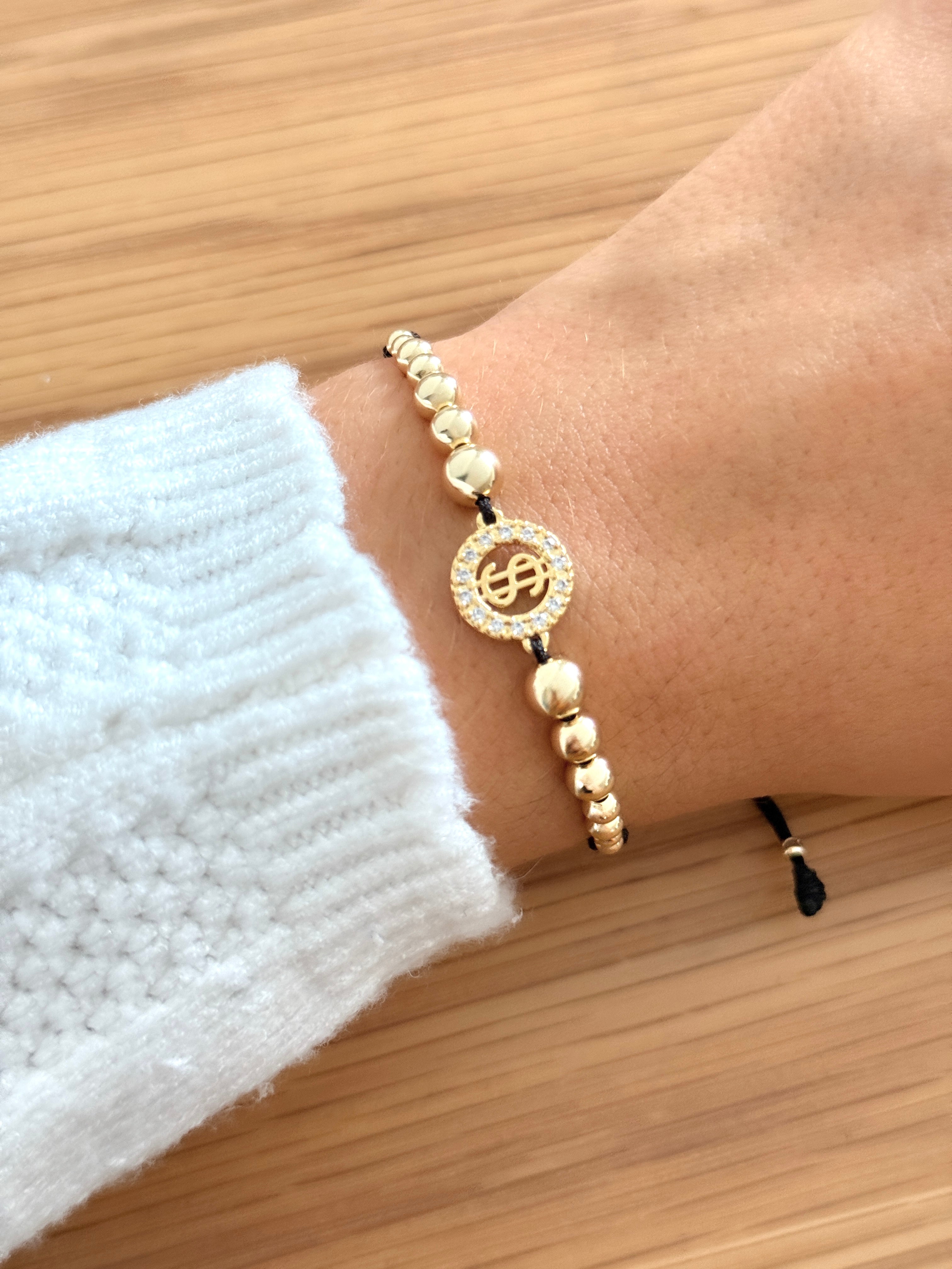 Pulsera artesanal signo pesos